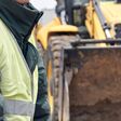 Heavy construction road works outdoors for public place reconstruction.