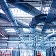 Air conditioning of buildings. Background of ventilation pipes. Laying of engineering networks. Industrial background