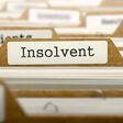Insolvent Concept. Word on Folder Register of Card Index. Selective Focus.