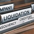 Company liquidation concept. File and tabs with the words insolvency, creditors and debts. 3D illustration