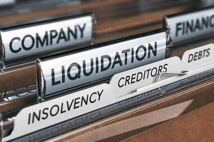 Company liquidation concept. File and tabs with the words insolvency, creditors and debts. 3D illustration