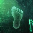 Green digital footprints on a circuit board background.