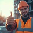 A construction worker giving a thumbs up after successfully completing a complex installation task.