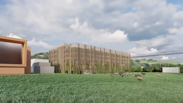 Das vollautomatisierte Hochregallager ist direkt in den Gebäudekomplex integriert. Verspiegelte Fassadenelemente sollen den hohen Baukörper optisch in die Umgebung zurücktreten lassen.