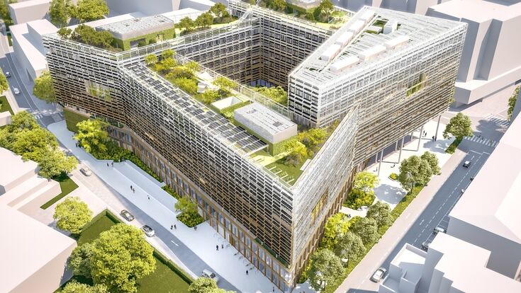 So soll das neue Landesdienstleistungszentrum in Salzburg aussehen: Das rund 50.000 Quadratmeter große Verwaltungsgebäude entsteht in Holz-Hybridbauweise und wird von der ARGE HABAU–SWIETELSKY errichtet. Die Visualisierung zeigt die markante Gebäudeform mit begrünten Dachflächen und Innenhöfen.
