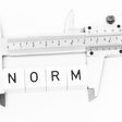 norm standard measurement rule guideline caliper instrument meter measure alphabet cubes symbol measuring device caliper gauge precision standardized normed gauging office symbolic presentation isolated block letters test control gauging standard testing inspection check accuracy exact fine tuning adjustment catchword norm symbol