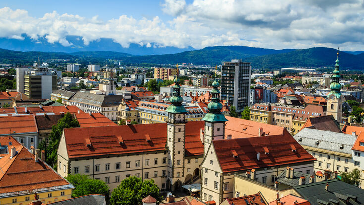 © Silvia Eder - stock.adobe.com Austria Carinthia Klagenfurt Kärnten Landhaus background beige blue church city clouds cloudy day football green holiday holidays houses mountains old orange over place sky spire stadium summer town view yellow austria carinthia klagenfurt kärnten landhaus background beige blue church city clouds cloudy day football green holiday holidays houses mountains old orange over place sky spire stadium summer town view yellow